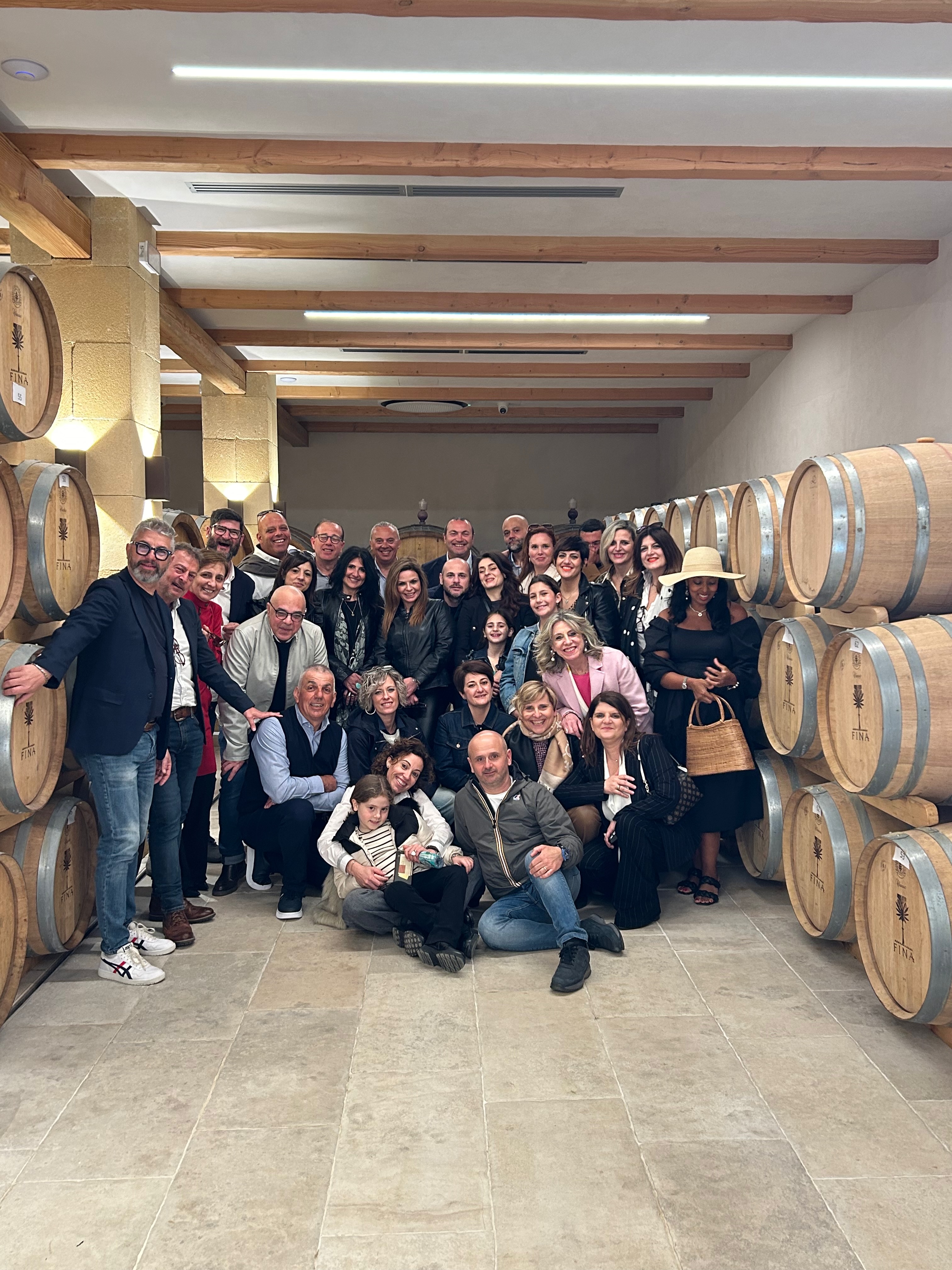Group at Fina winery barrel cellar