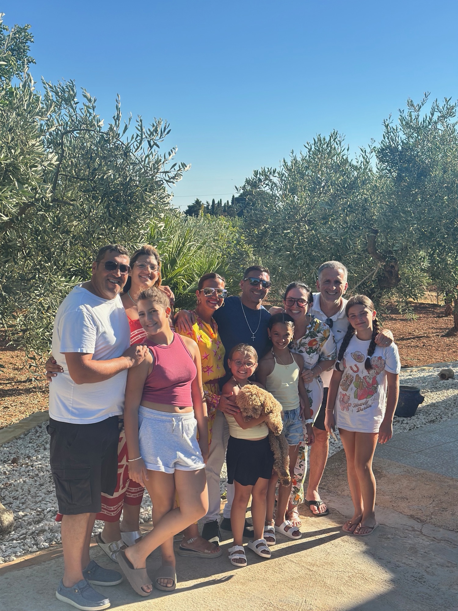 Josephine's family gathered in the olive grove in Partanna, Sicily — five generations of olive farming in the Belice Valley